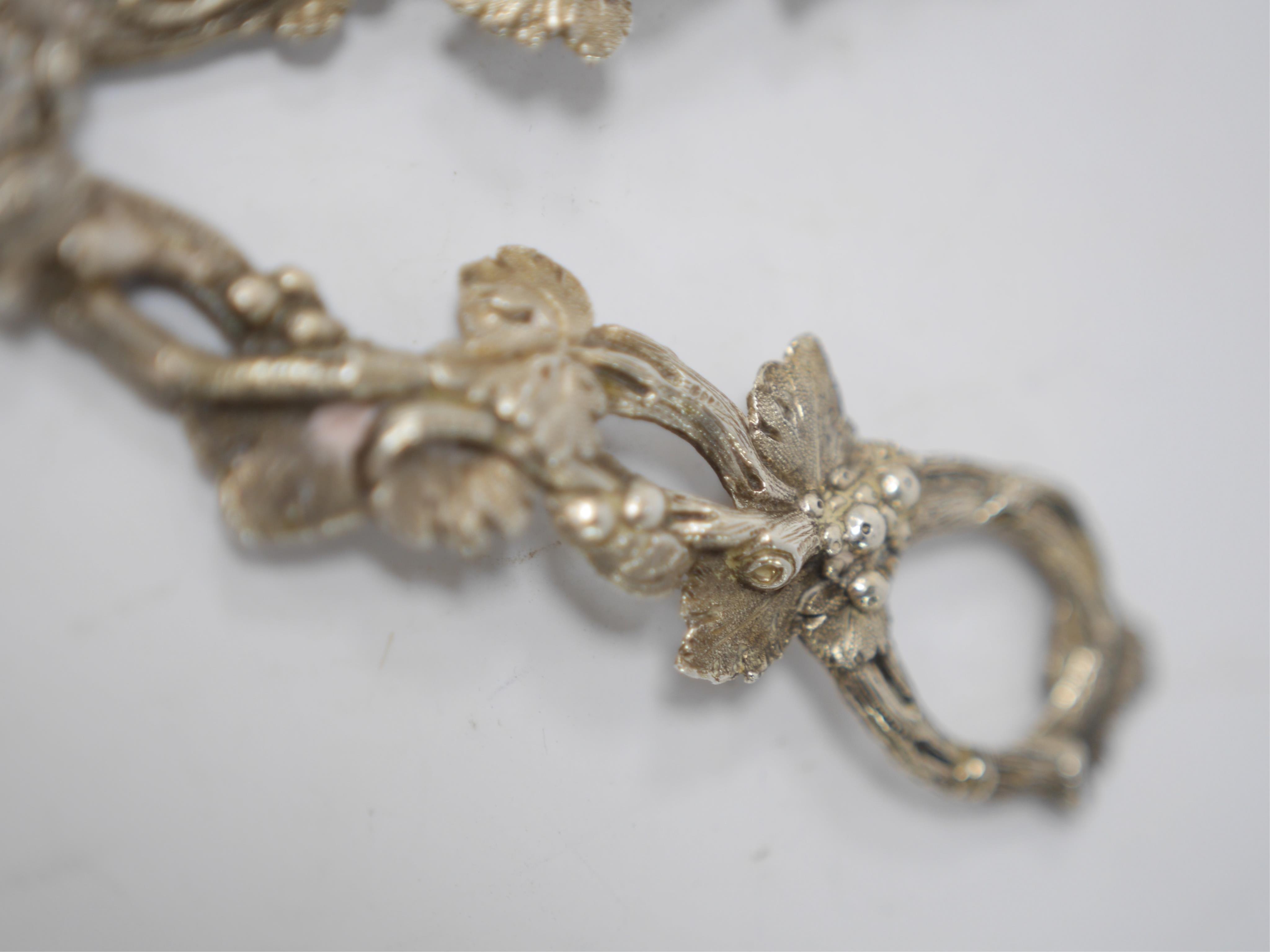 A pair of Victorian silver grape shears with fruiting vine handles, Martin, Hall & Co, Sheffield, 1884, 17.1cm. Condition - good